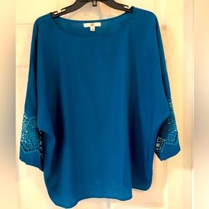 3/4 sleeve dress or casual shirt. Teal green in color.